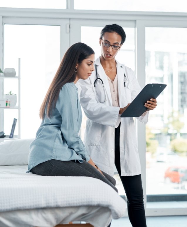 Female Doctor Talking to Patient