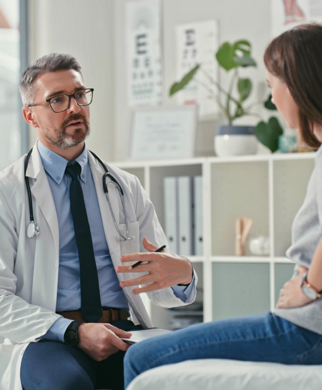 Male Doctor Talking to Patient Landscape