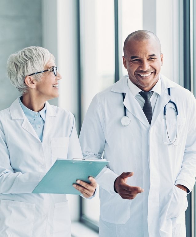 Women and Male Doctors Walking